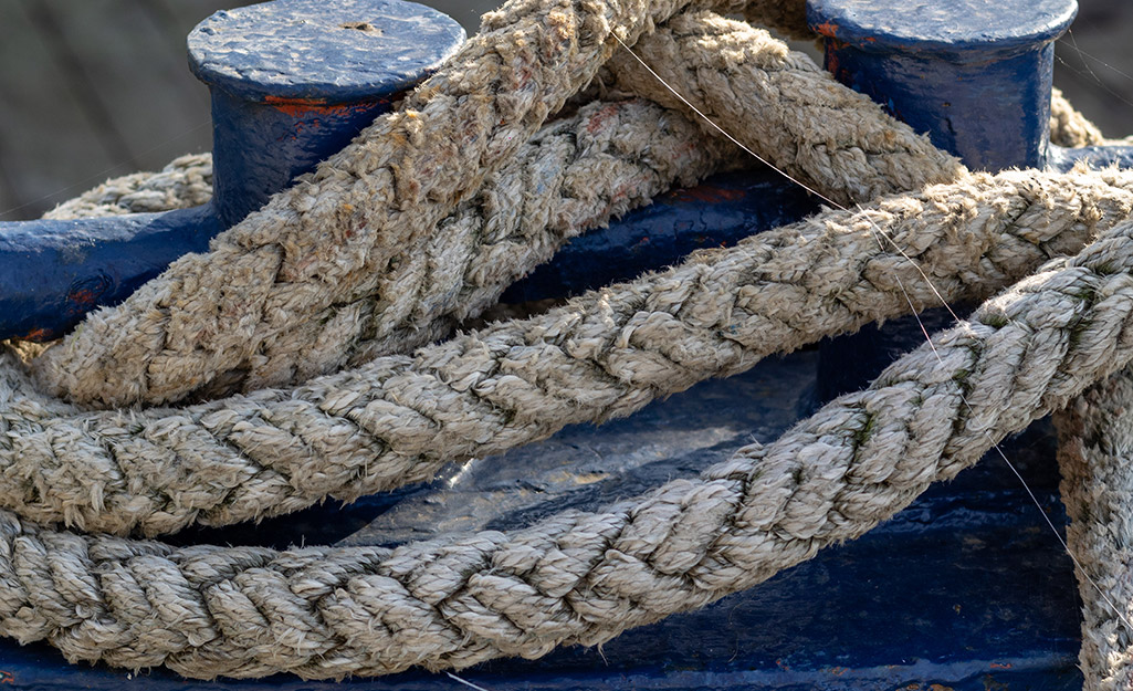 Thick Coiled Manila Rope Hanging Over a Wooden Fencepost in a Rural Ranch  Setting in Summer Stock Photo - Image of braided, wooden: 242554336