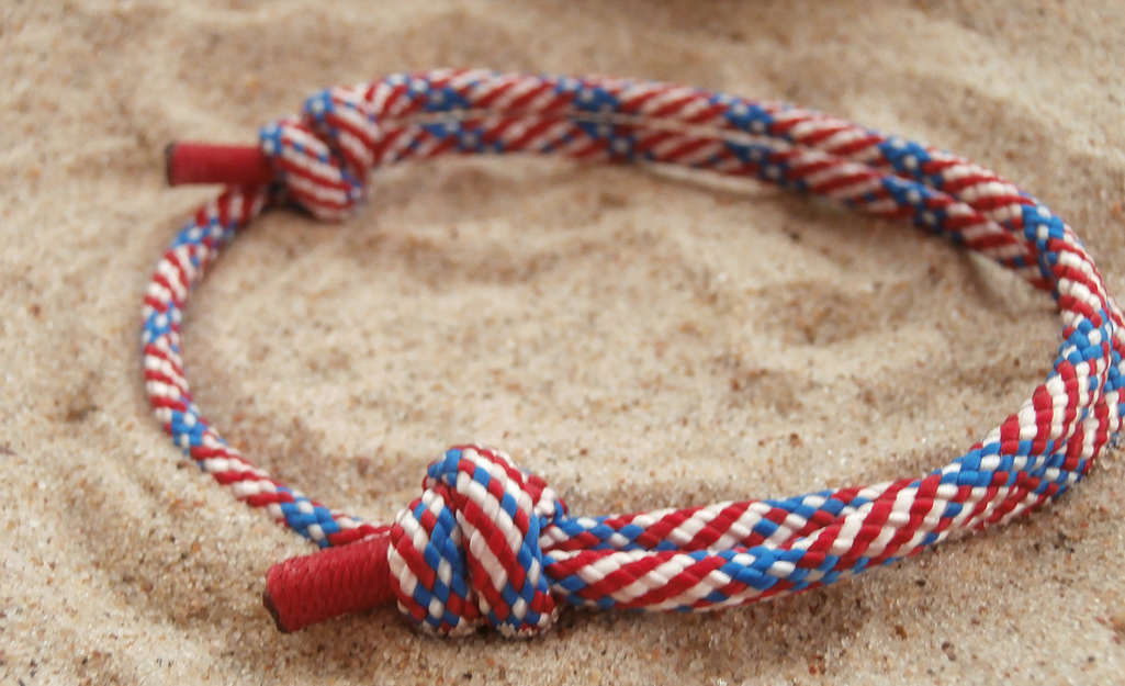 A bracelet made from multicolored nylon rope.