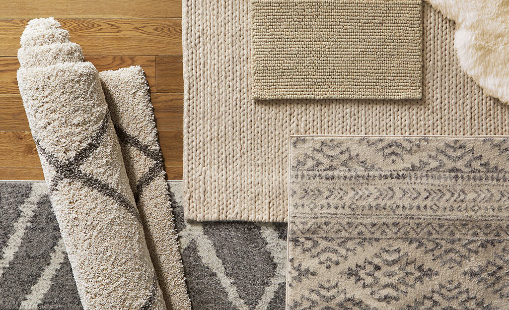 Area rugs of different sizes lay on a hardwood floor.