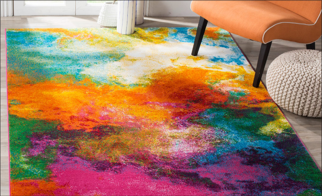 A watercolor rug lays near French doors.