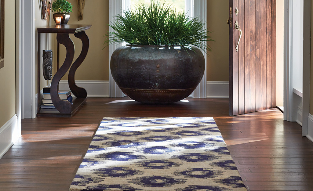 An ikat rug in an entryway.