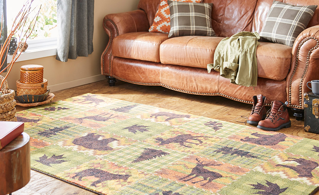 A lodge rug with a multiple animal theme.