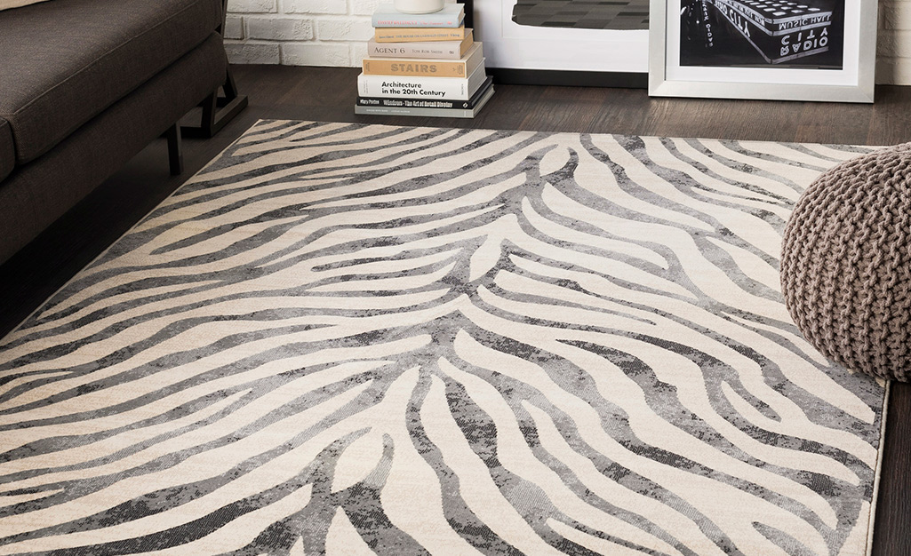 Animal print rug on a living room floor. Animal print rug on a living room floor.