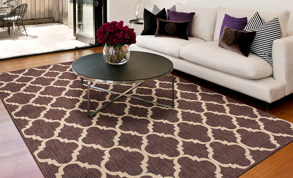 A trellis rug in a living room.