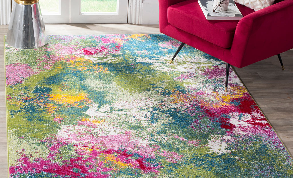 A watercolor rug placed near a french door.