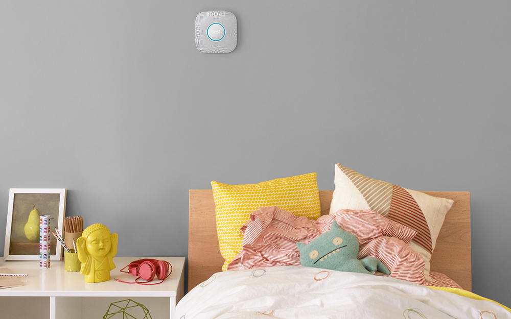  A smoke detector above a bed.