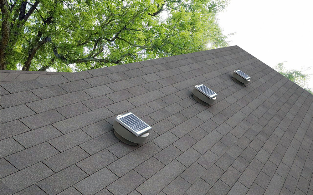 Box roof vents on the top of a house.