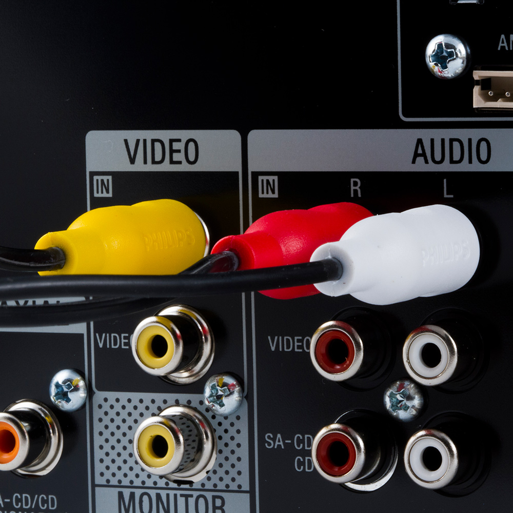 Video and audio cables plugged into equipment.