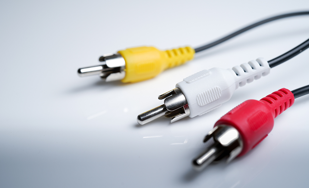 Composite video cables lying on a counter.