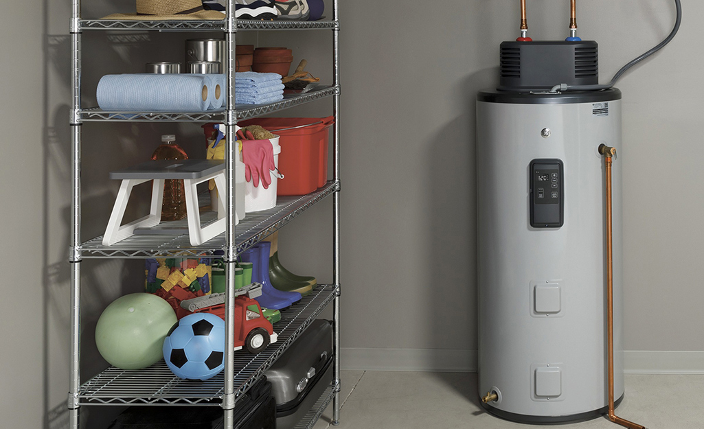 A tank water heater installed in a garage