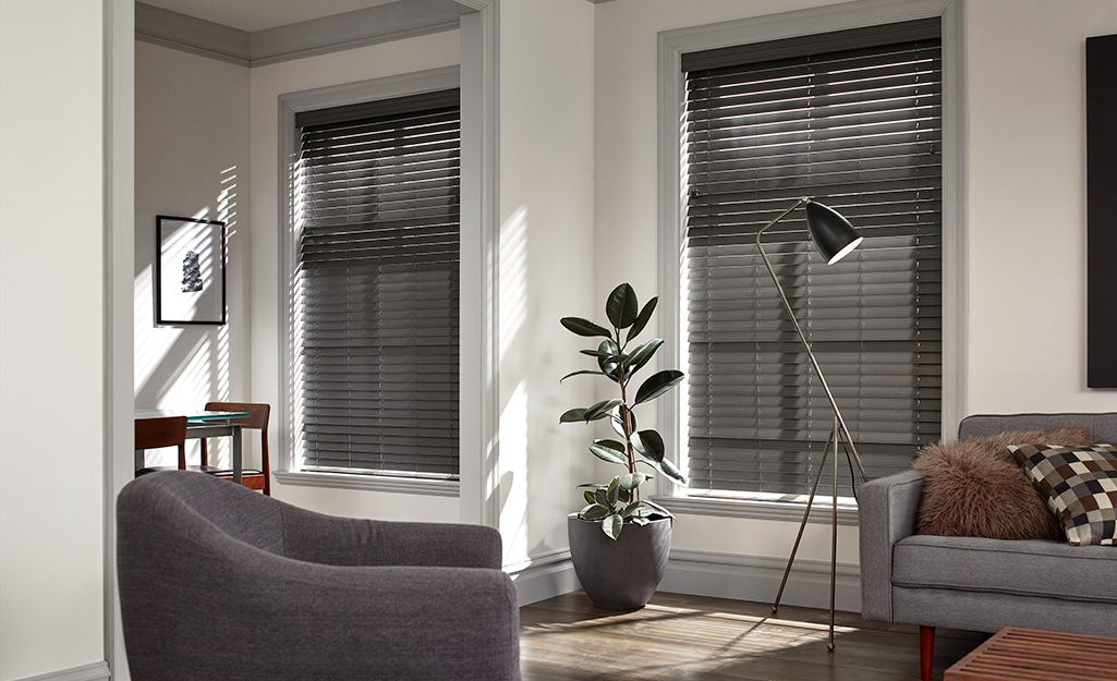 Dark wood blinds installed in a living room.