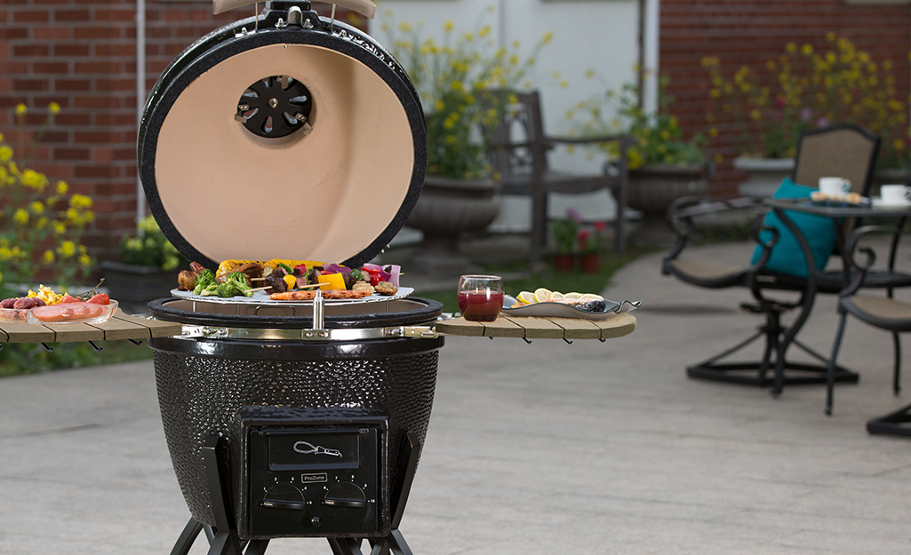 Food cooking on a kamado grill. Food cooking on a kamado grill.