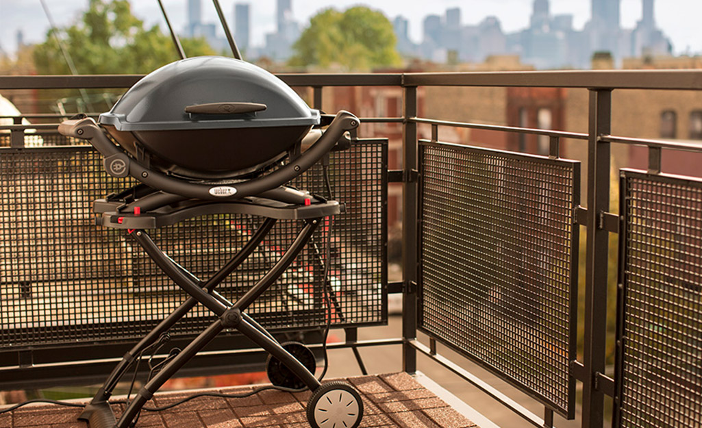 An electric grill on a patio. An electric grill on a patio.
