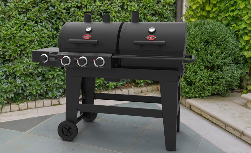 A variety of food cooking in grill-smoker. A variety of food cooking in grill-smoker.