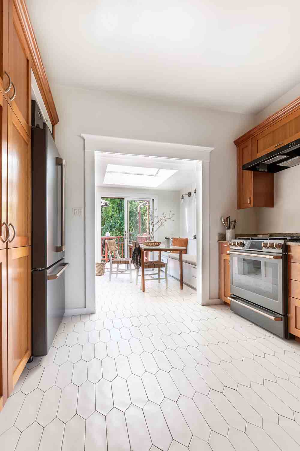 A kitchen with updated flooring.