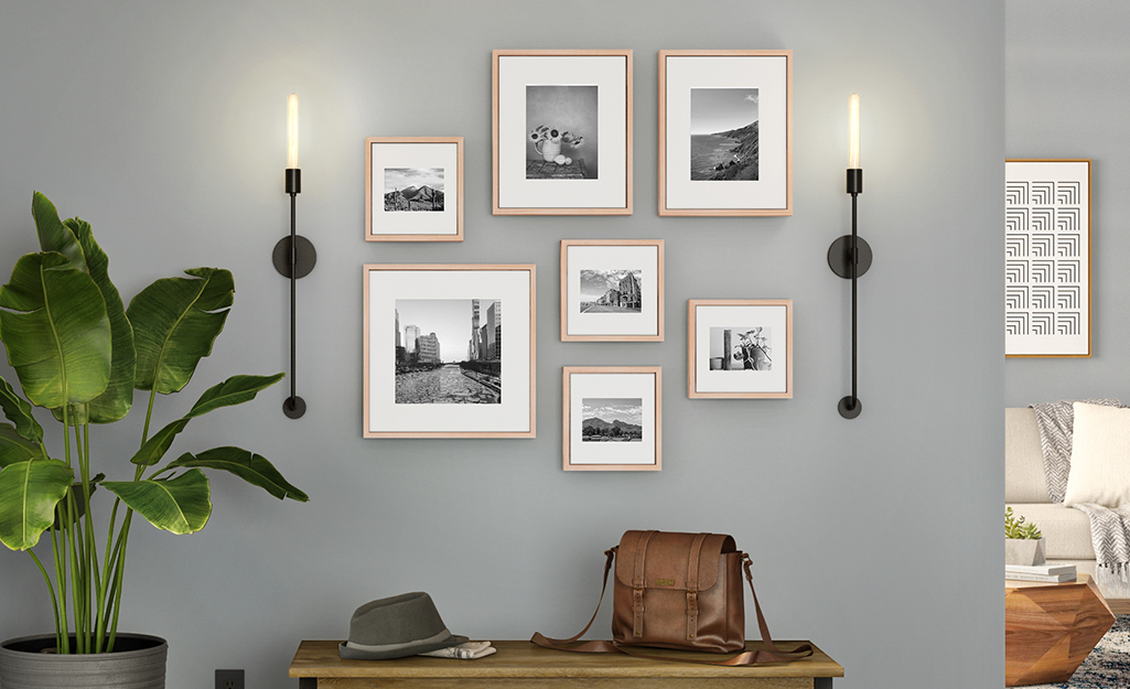 A gallery wall hung with wall art and candles.