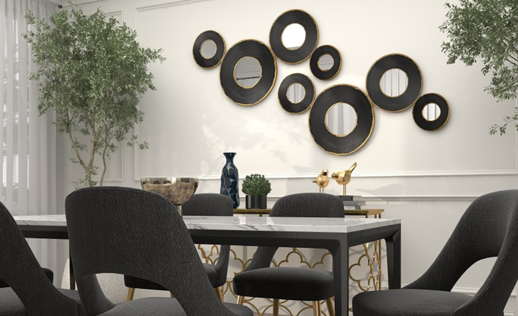 A group of mirrors in different sized circles styled as wall art.