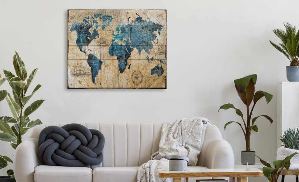 Framed map used behind a sofa as wall art.