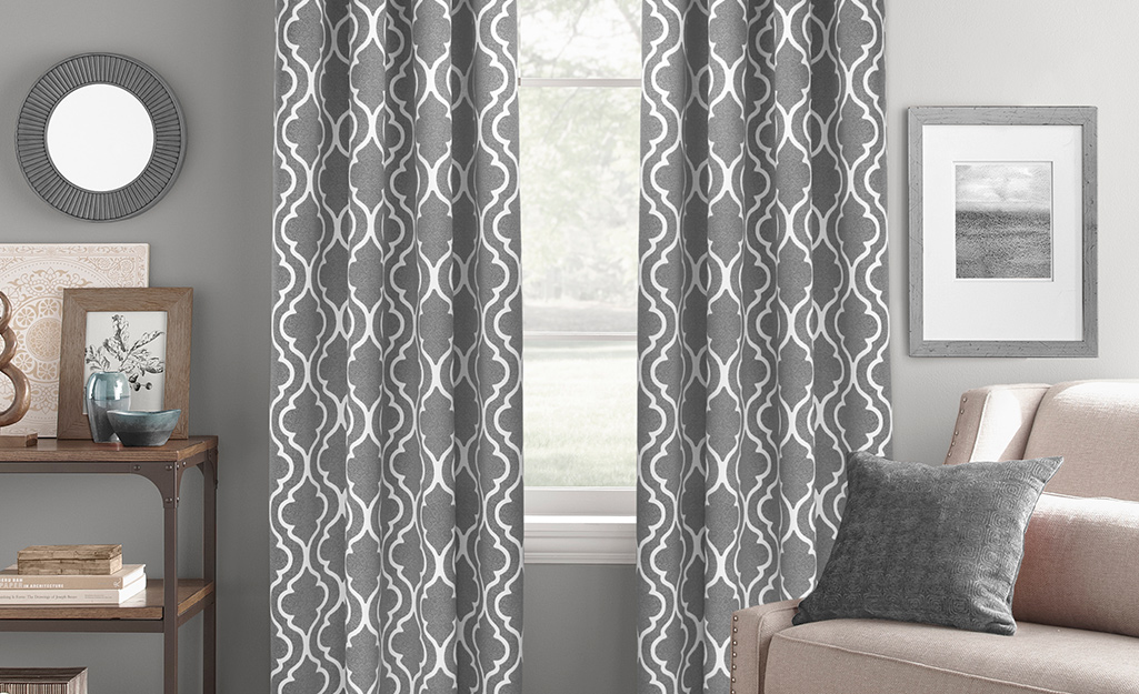 Windows with grey and white curtains as wall art.