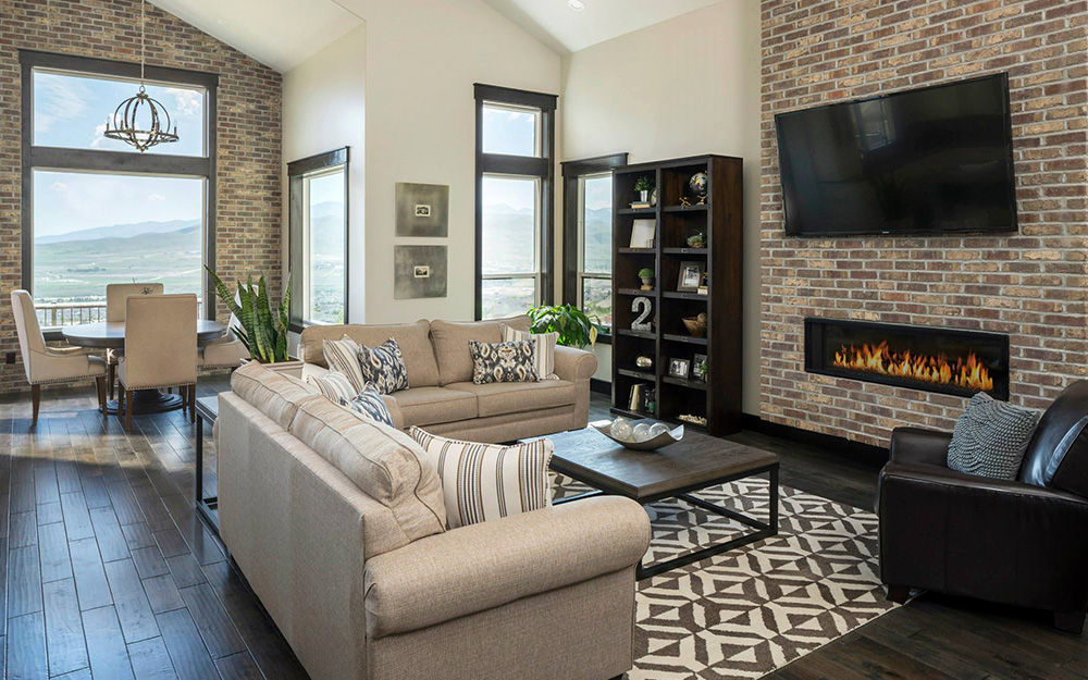 A living room with brick style wall paneling.