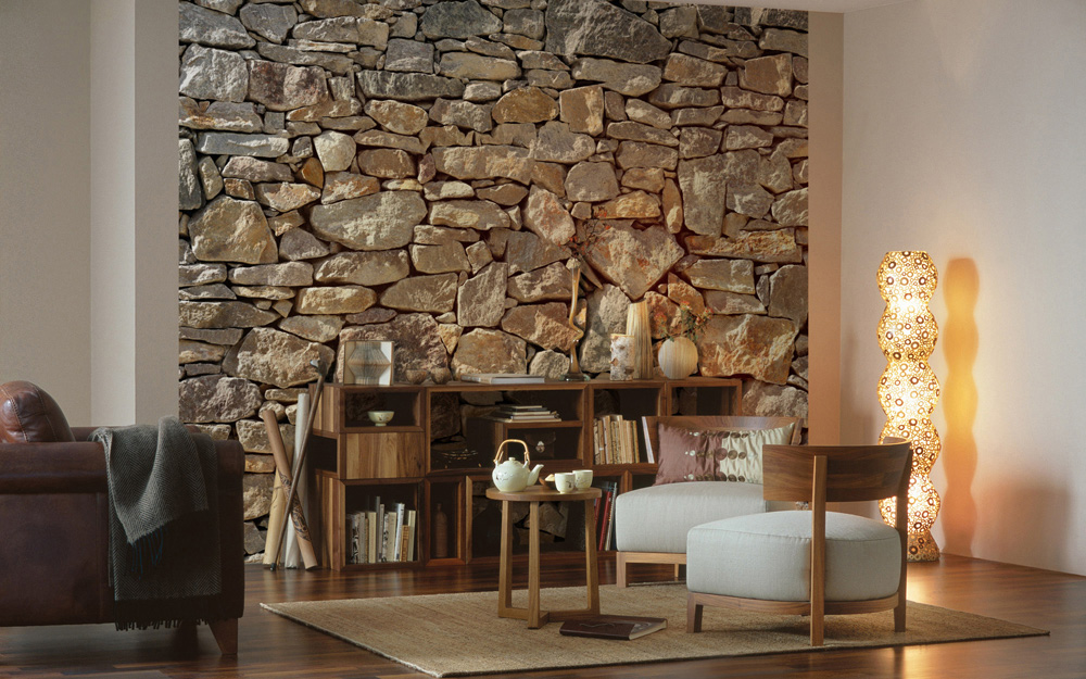 A living room featuring stone wall paneling on an accent wall.