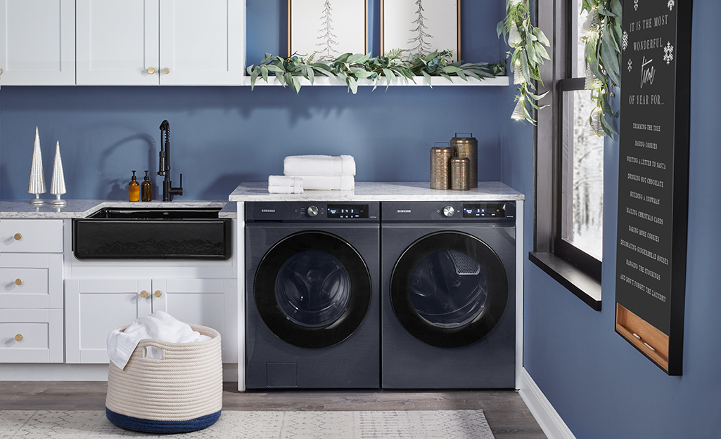 A front-loading washer and dryer in a laundry room.