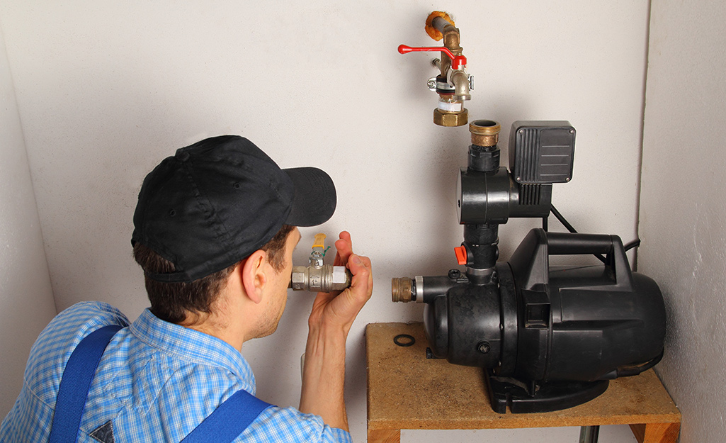 Man installing a utility pump.