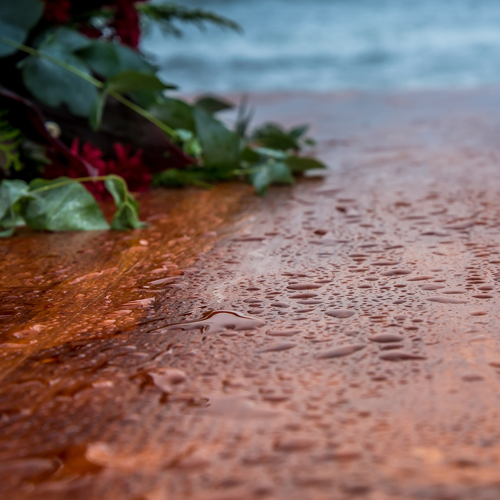 Rain on a wood deck.