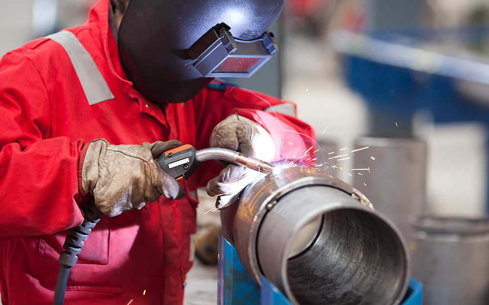 A person welding metal