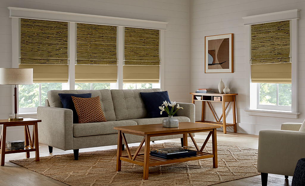 A living room with bamboo blinds.