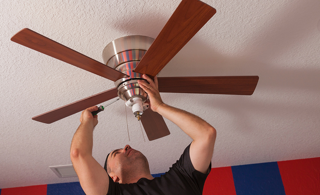 Someone changing direction on a ceiling fan.