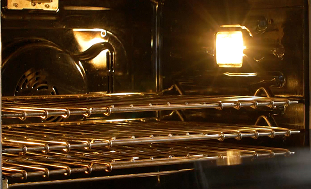 Three clean oven racks positioned in an oven. Three clean oven racks positioned in an oven.