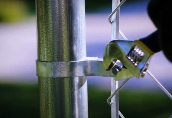 Attach tension bar - Install Chain Link Fence Attach tension bar - Install Chain Link Fence