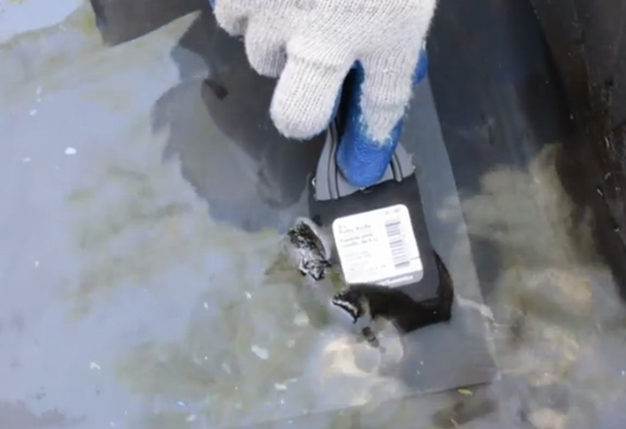 Cut flashing position over hole - Repairing Metal Gutters Cut flashing position over hole - Repairing Metal Gutters