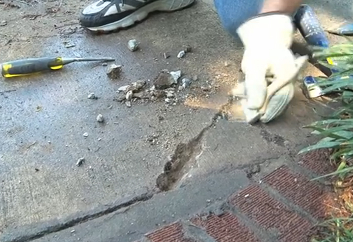 Clean out debris with stiff fiber - Minor Sidewalk Repairs Clean out debris with stiff fiber - Minor Sidewalk Repairs