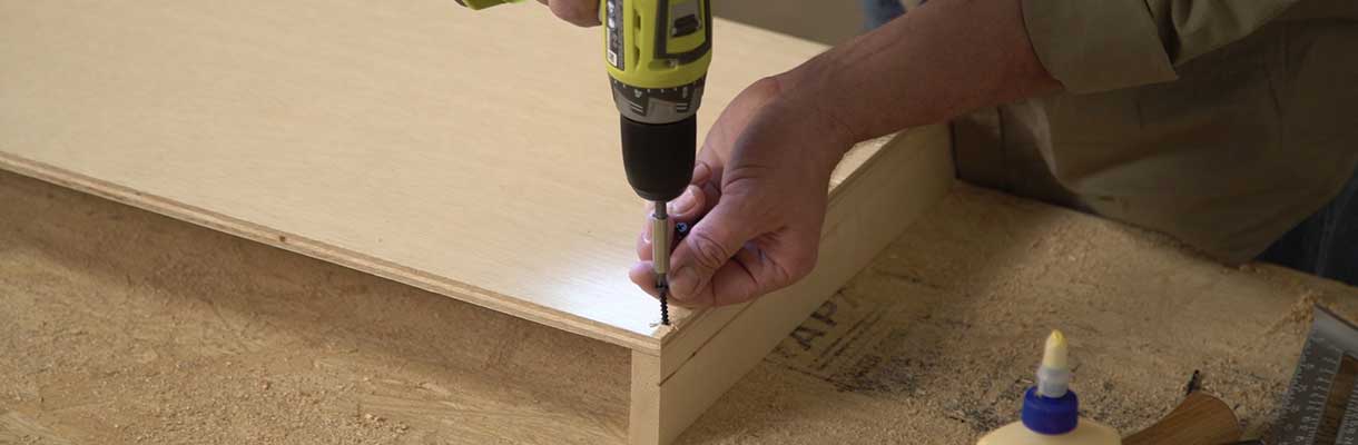 Attach feet to bottom shelf Attach feet to bottom shelf
