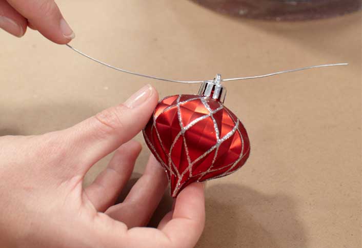 Thread wire through ornaments - Make Ornament Garland Thread wire through ornaments - Make Ornament Garland