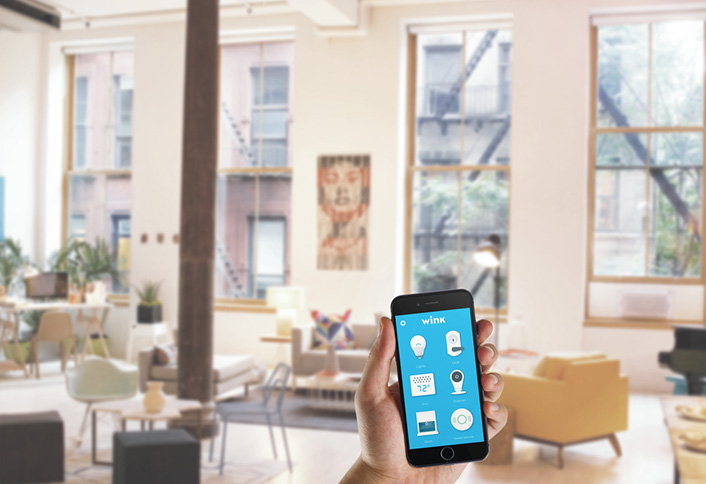 Wink Application on a Phone in a loft apt with tall windows. Wink Application on a Phone in a loft apt with tall windows.
