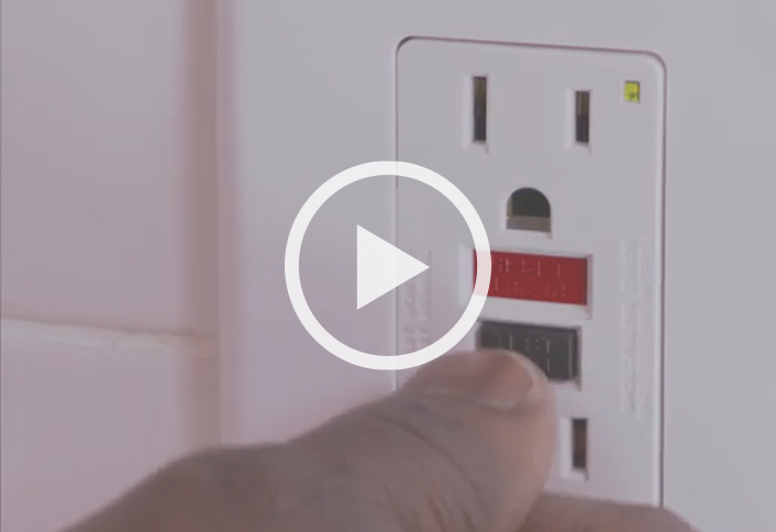 Electrical outlet with reset button