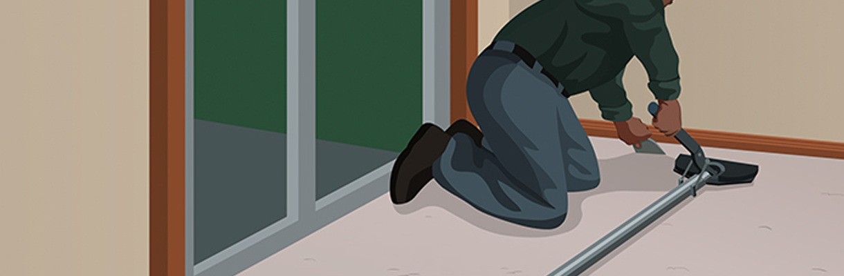 Step 12: Person Using Carpet Tucker and Stretcher to Anchor Corner of Room Step 12: Person Using Carpet Tucker and Stretcher to Anchor Corner of Room