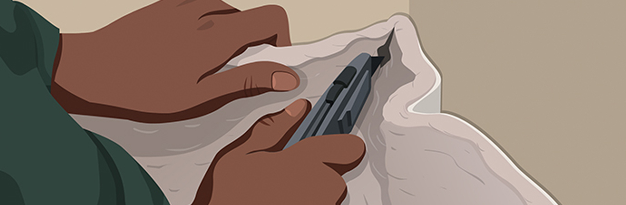 Step 4: Person Cutting Relief Cuts in Corners of Carpet with Carpet Knife Step 4: Person Cutting Relief Cuts in Corners of Carpet with Carpet Knife