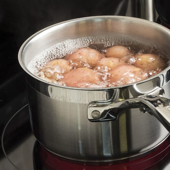 Potatoes boil in a pot