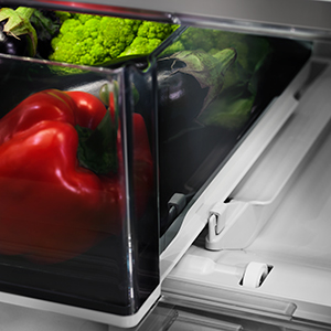 Fully stocked crisper drawer, partially extended, showing the SATINGLIDE Rail System. Fully stocked crisper drawer, partially extended, showing the SATINGLIDE Rail System.