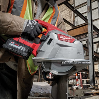 Man wearing a hi-vis vest and work gloves uses the M18 FUEL 8" Metal Cutting Circular Saw on corrugated decking