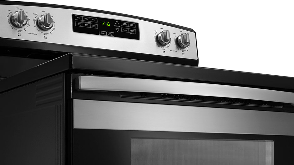 An exterior view of the controls on a stainless steel range. An exterior view of the controls on a stainless steel range.