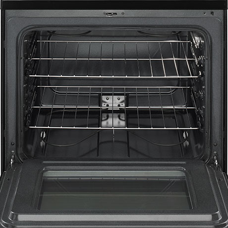 The oven door is open to show the two baking racks inside.