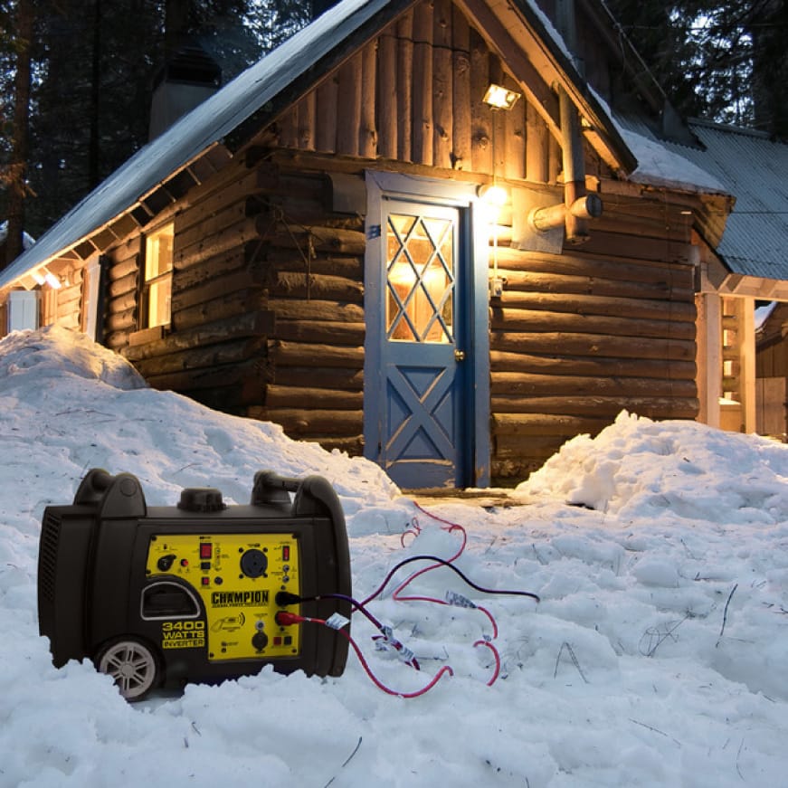 Lifestyle image of inverter generator powering a cabin in snow