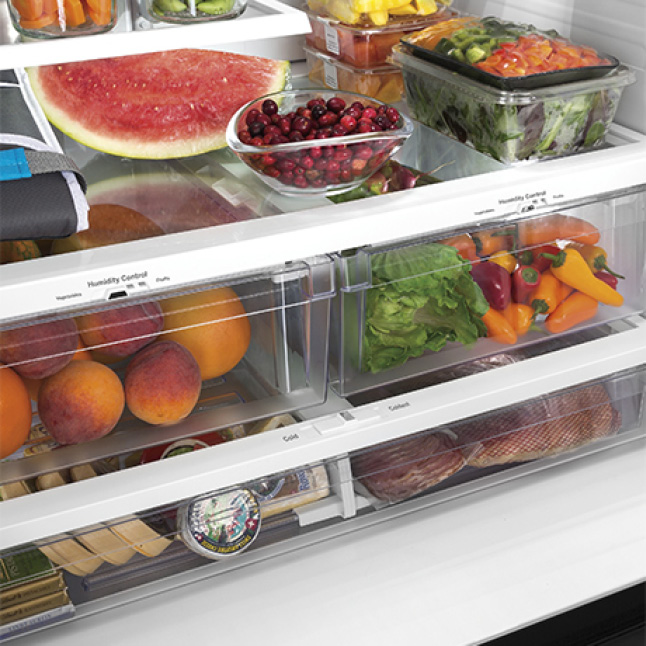 A variety of fresh fruits, vegetables, meats and cheeses are held inside the fridge's drawers, each with its own humidity and temperature controls.