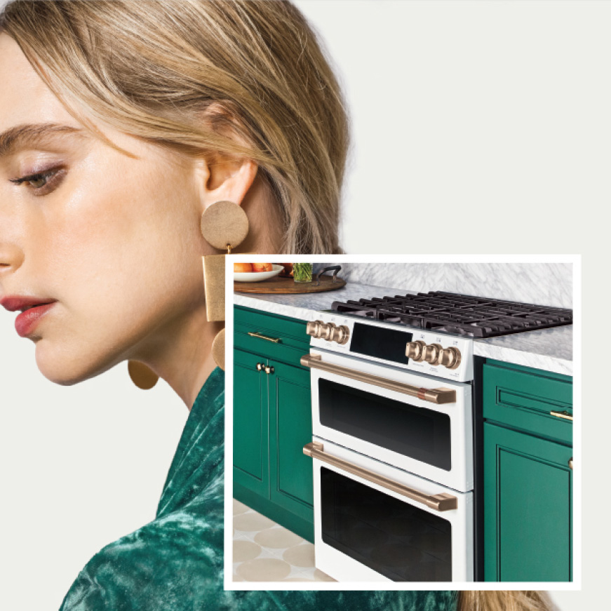 Beauty shot of woman with image of Matte White gas double oven range in set Beauty shot of woman with image of Matte White gas double oven range in set