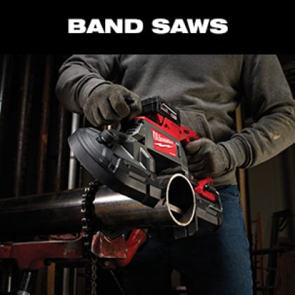 Man wearing work gloves uses the M18 FUEL Dual-Trigger Band Saw to cut a metal pipe.